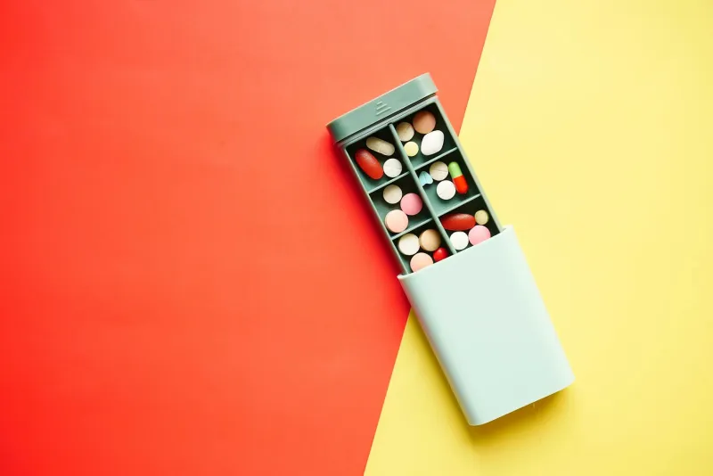 Different multivitamin forms: tablets, capsules and liquid
