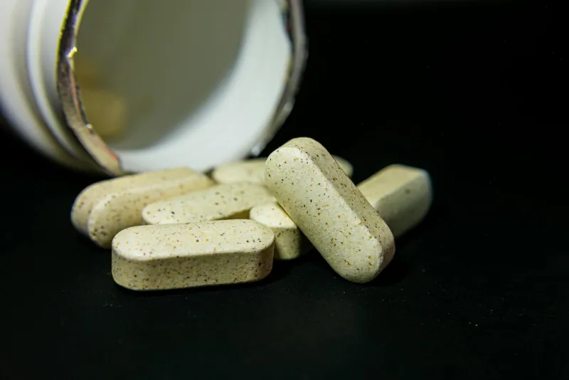Vitamin D3 and D2 capsules in sunlight