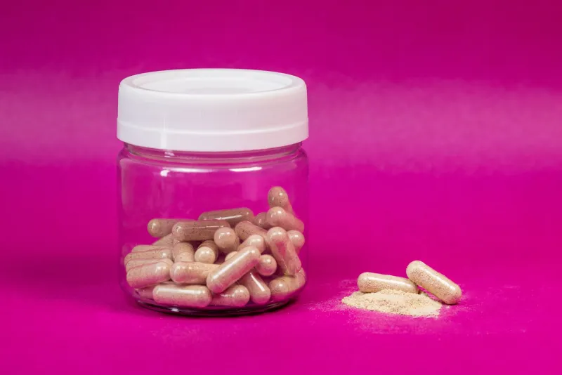 Maca root and capsules, Andean herbal adaptogen
