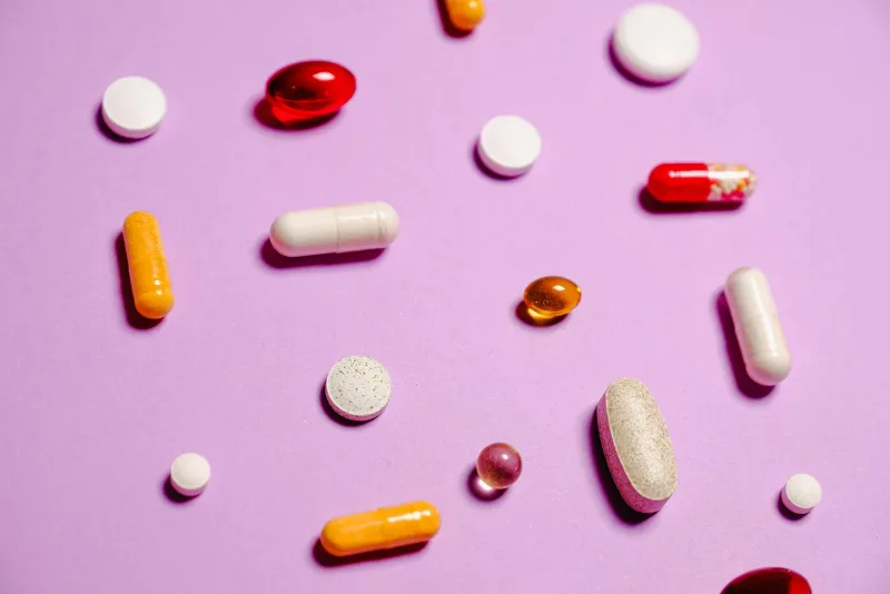 Person sleeping peacefully in a dark room, melatonin supplement