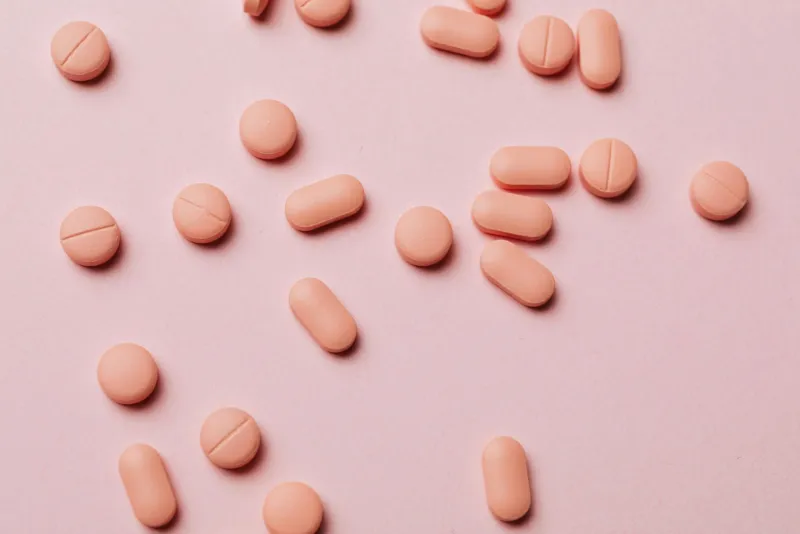 Woman taking dietary supplements for good health support