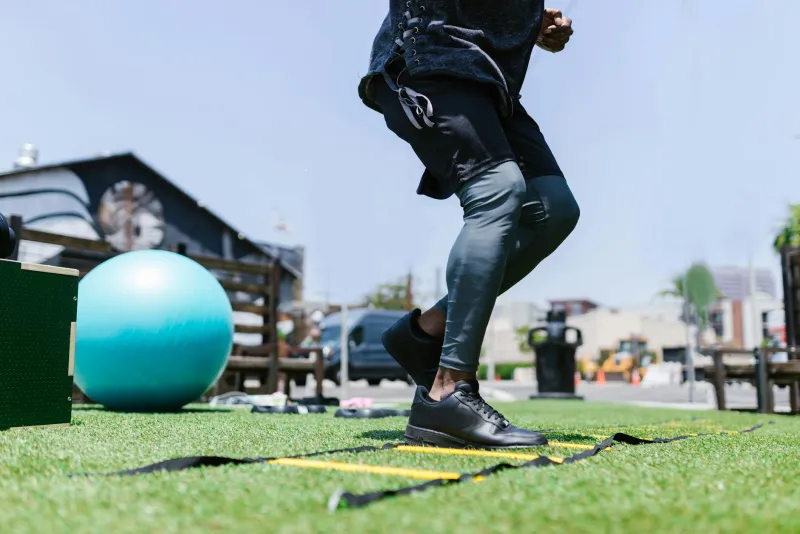 Athlete performing interval sprints on a running track