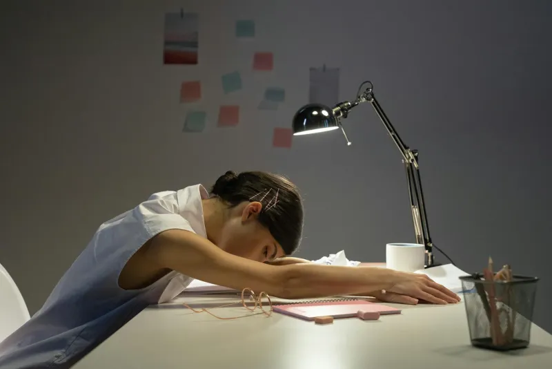 Leafy greens and vitamin K capsules illustrating sleep and stress research