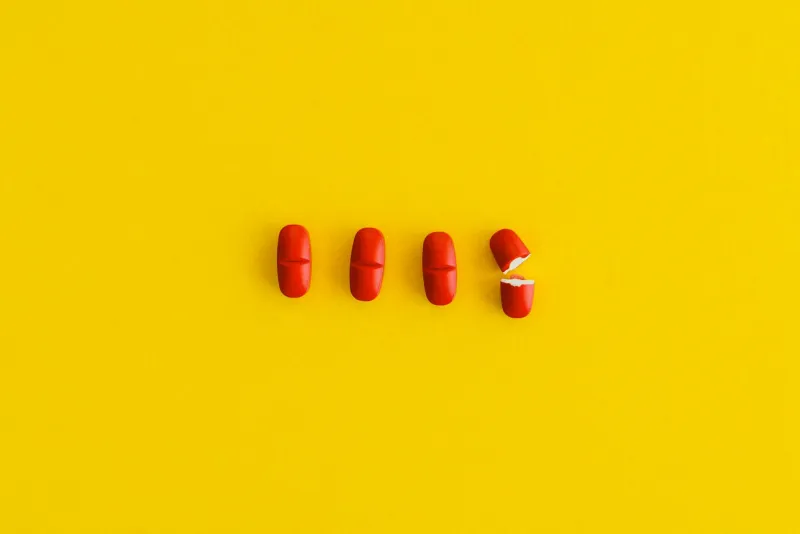 Senior adult holding a bottle of vitamins
