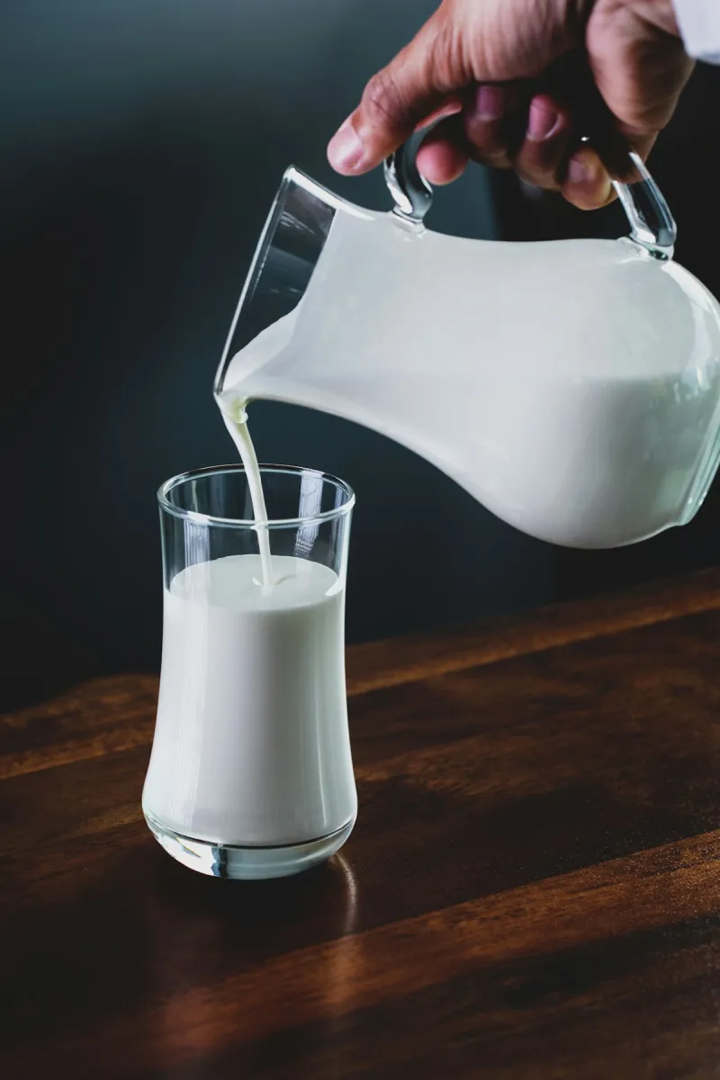 Milk being poured into a glass - natural source of casein protein